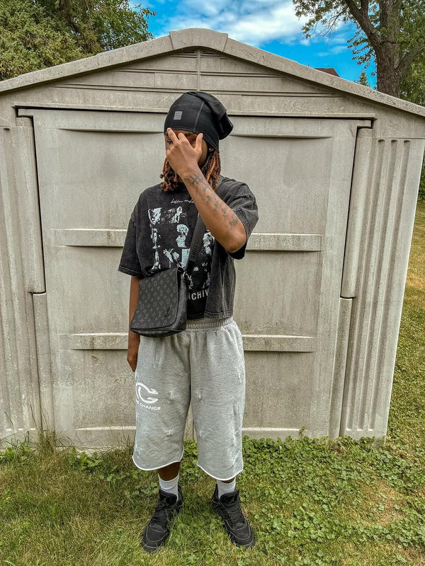 Customer in a grey One Chance set outdoors