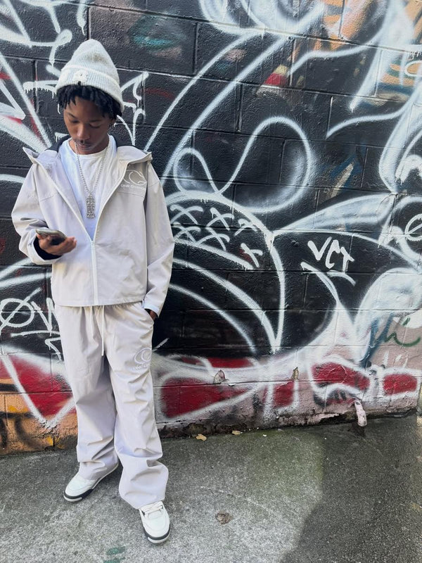 Customer in a cream One Chance set against a graffiti wall