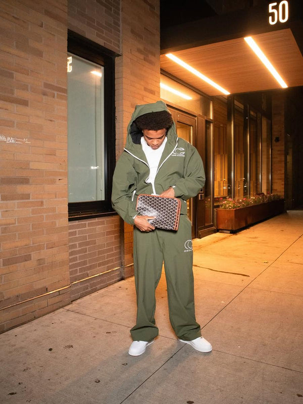 Customer in an olive One Chance hooded set