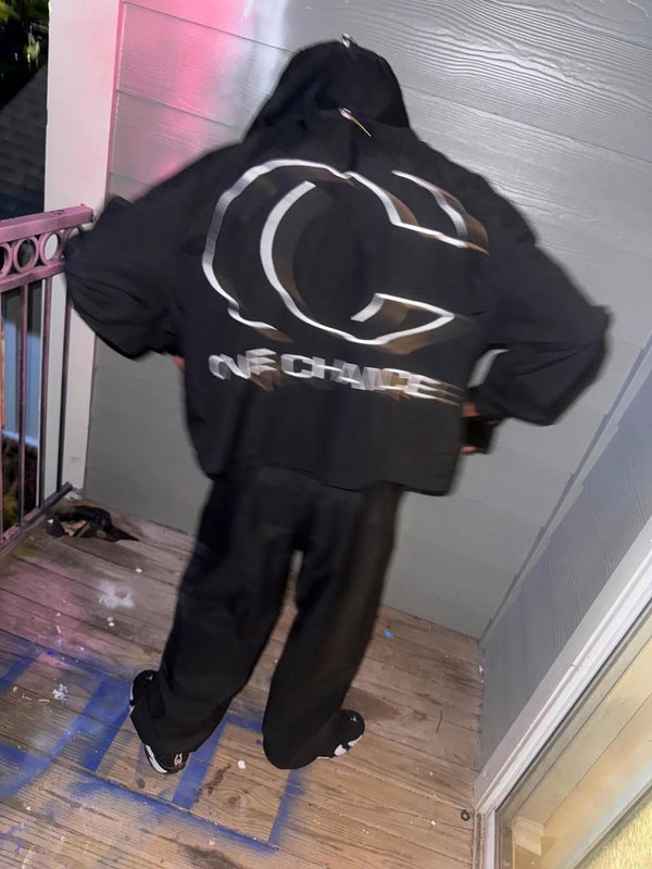 Customer in a black One Chance set with the CG logo on the back